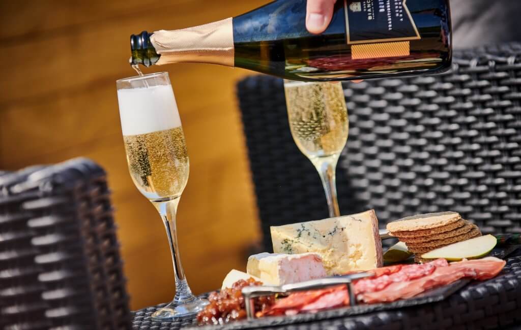 Pouring the Complimentary Champagne at Luxury Hideaways.